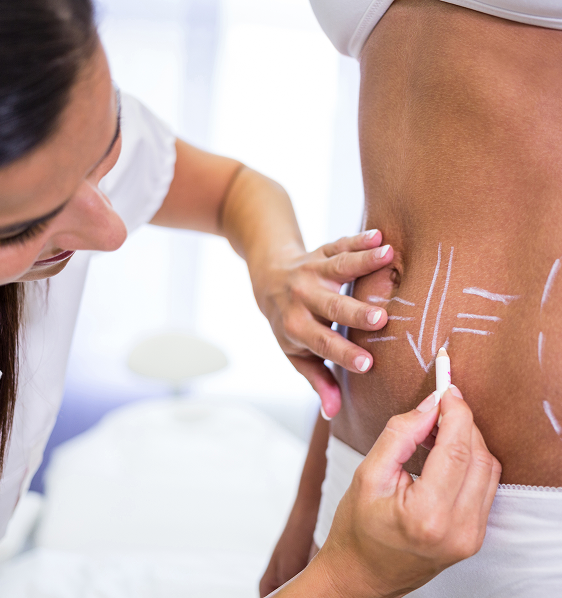 A woman relaxing in a lounge chair beside a sunlit window after a VYVORA SLIMS treatment session
